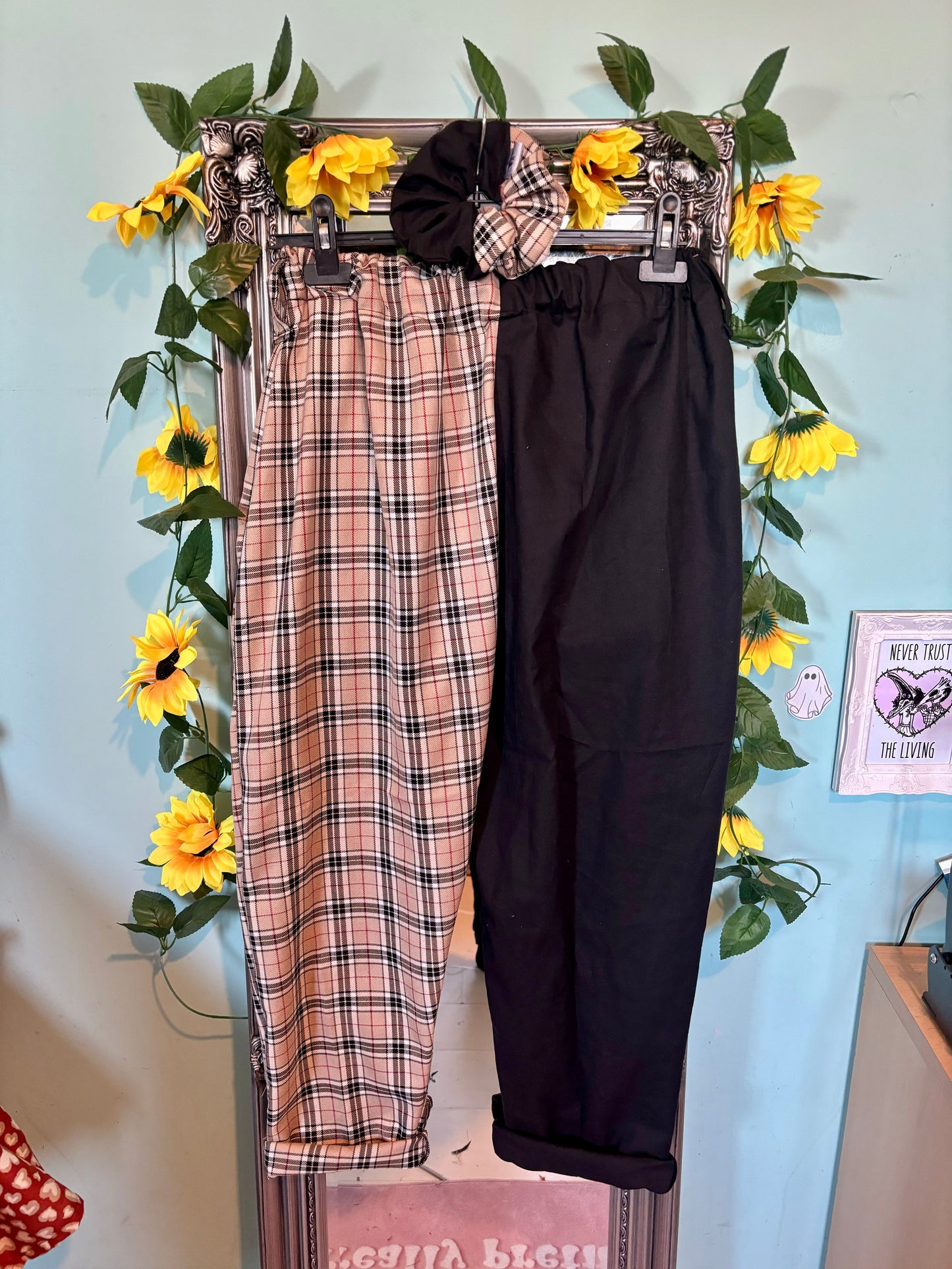 Miss matched caramel tartan and black tapered leg trousers